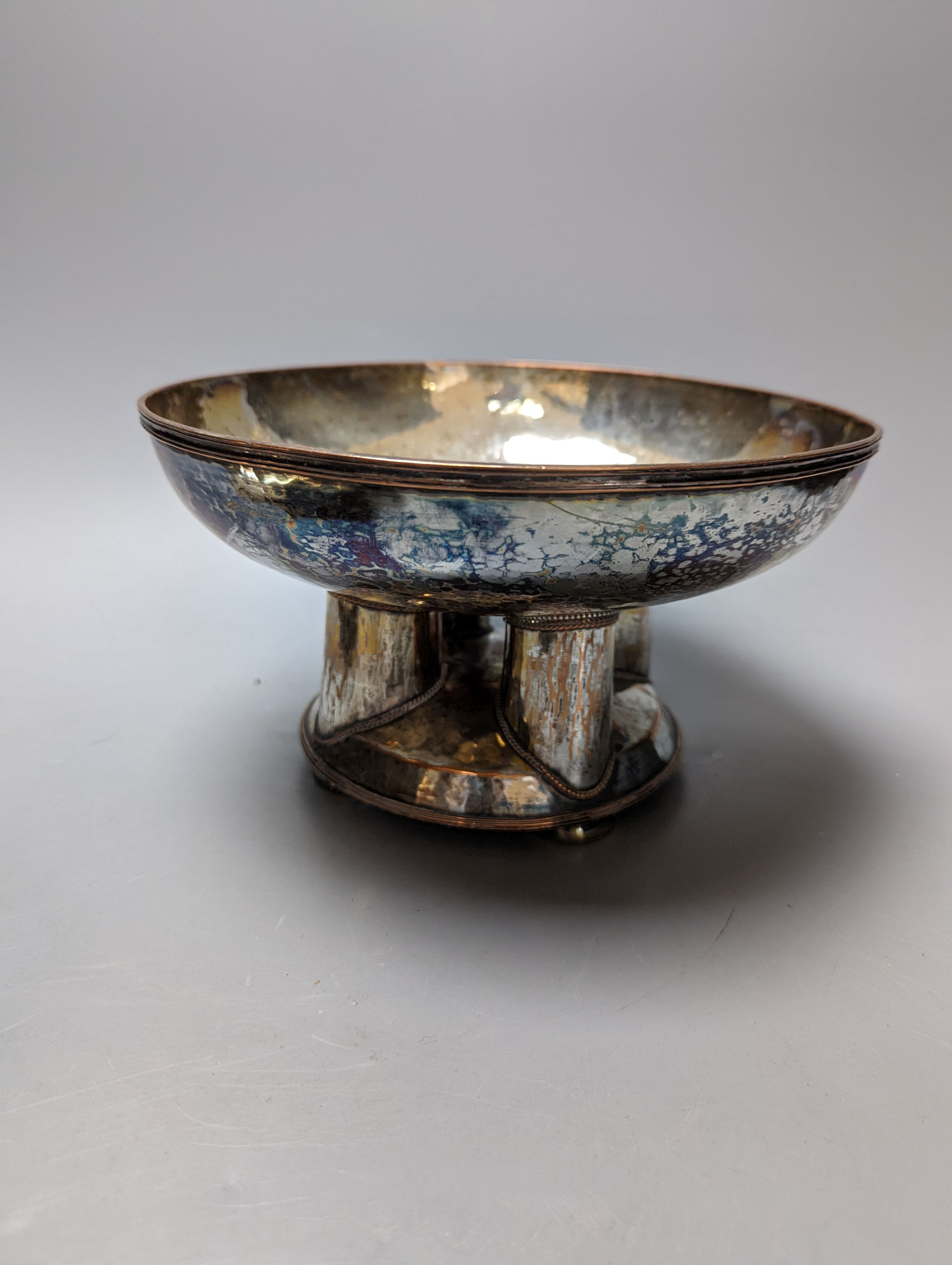 A Tudric pewter oval bowl, model no. 0535, 25cm long and an Arts & Crafts style plated pedestal bowl, 21.5cm diameter